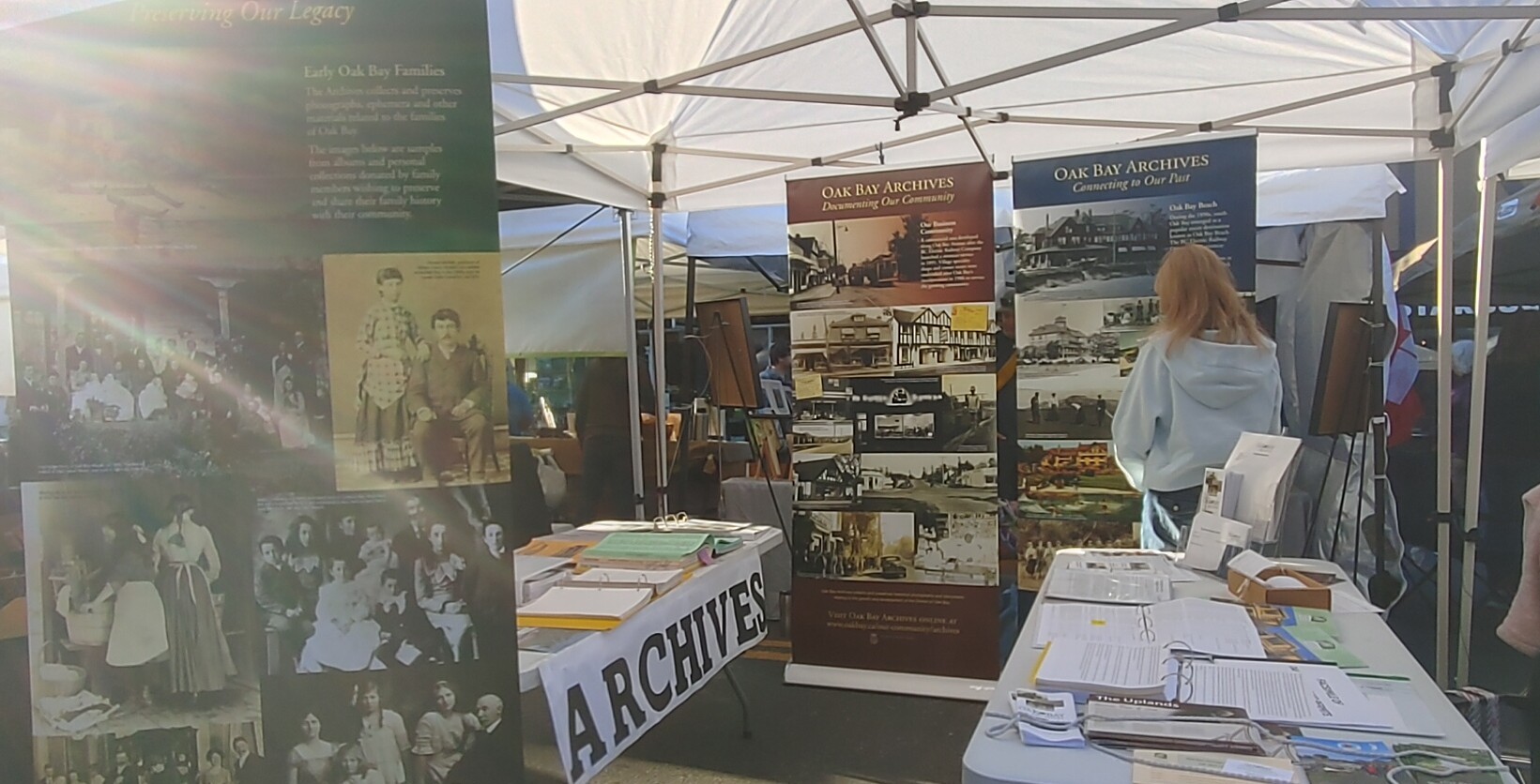The night markets have gone well again this year – layout is much improved over last year and the repositioned photo banners are very effective at drawing people in and getting them talking. They were made in 2014 and are standing the test of time! There is also a map showing where in the Oak Bay Village "core" several of the buildings pictured still stand, and a complete list of sources for the photos on the banners.